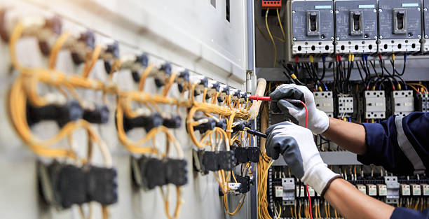 Professional Electrician technician working in Muscle Shoals, AL